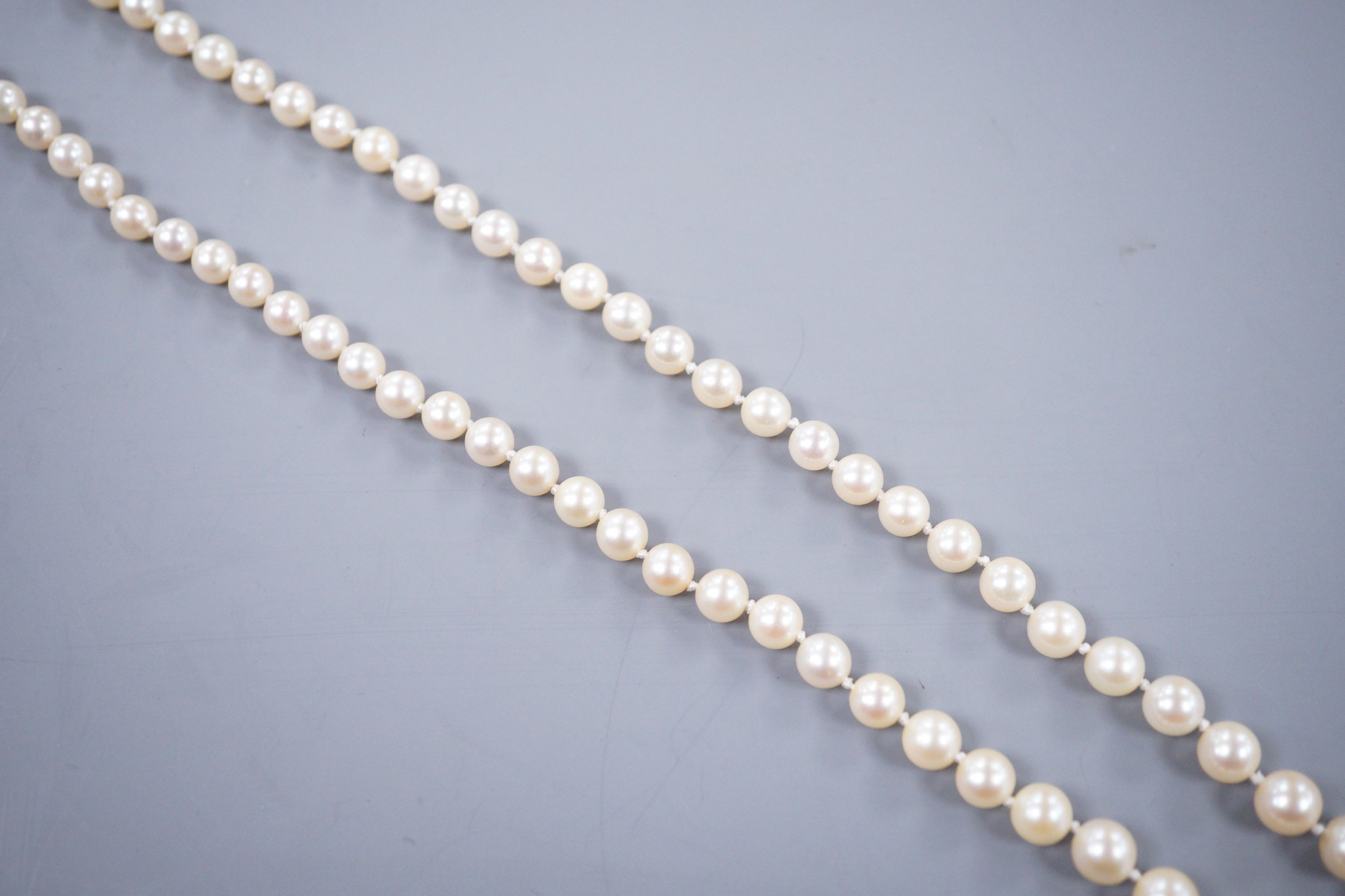 A single strand graduated cultured pearl necklace, with rose cut diamond set yellow metal clasp, 52cm.